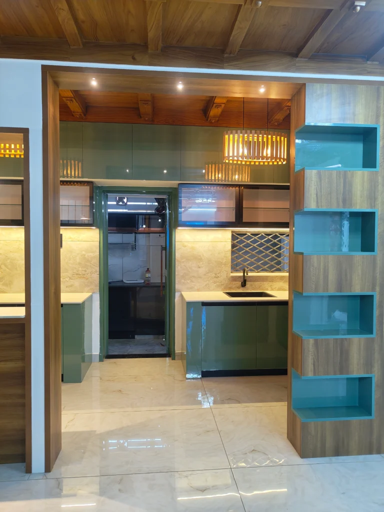Kitchen seen through a timber frame with teal open shelving