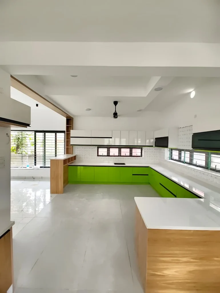 Lime green kitchen with a white-topped oak island and a long window over the worktop