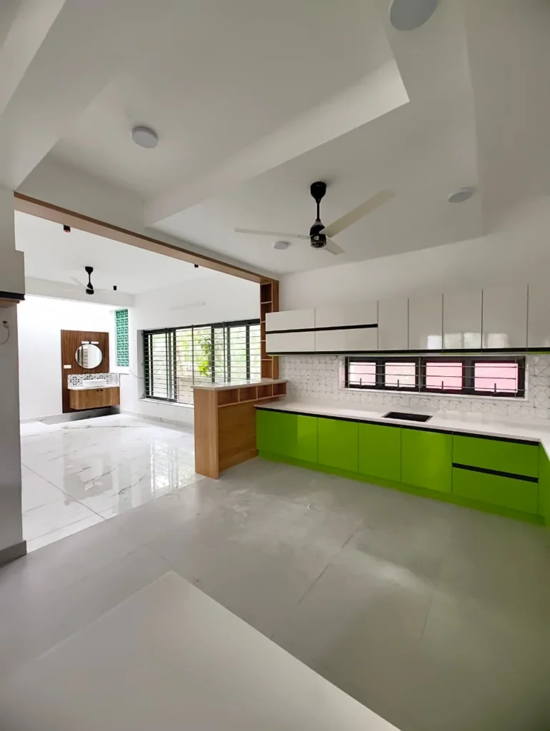 Lime green kitchen cabinets with white worktops and open shelving under a stepped ceiling
