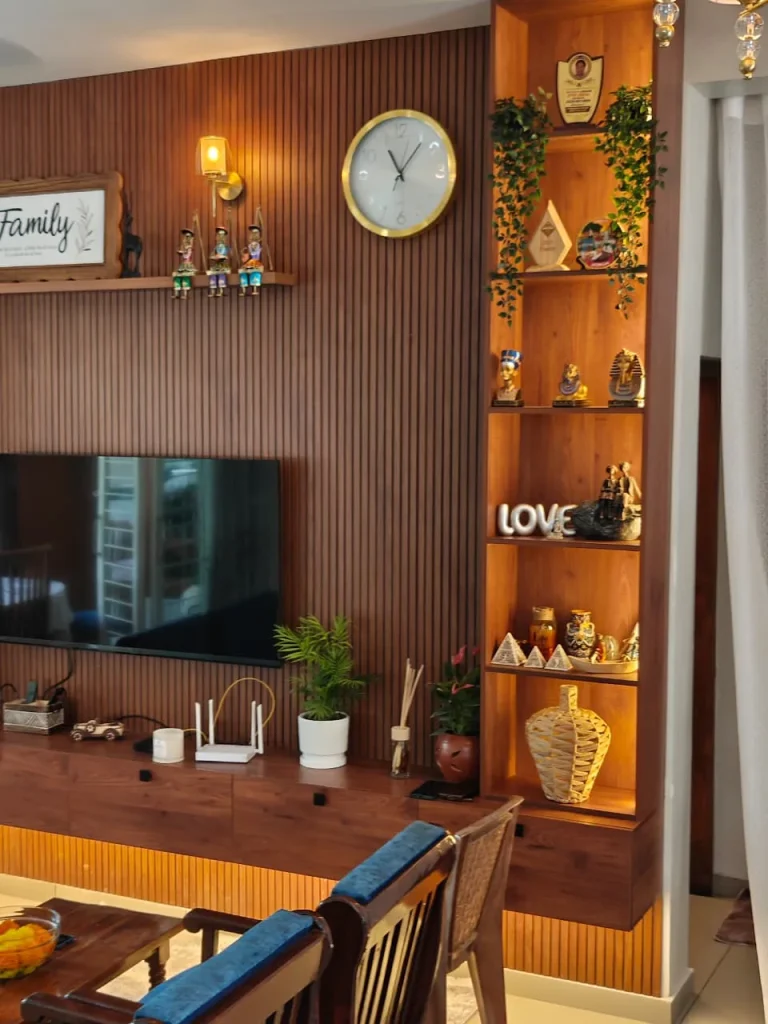 Fluted timber TV wall with a lit display shelf unit and a floating TV console