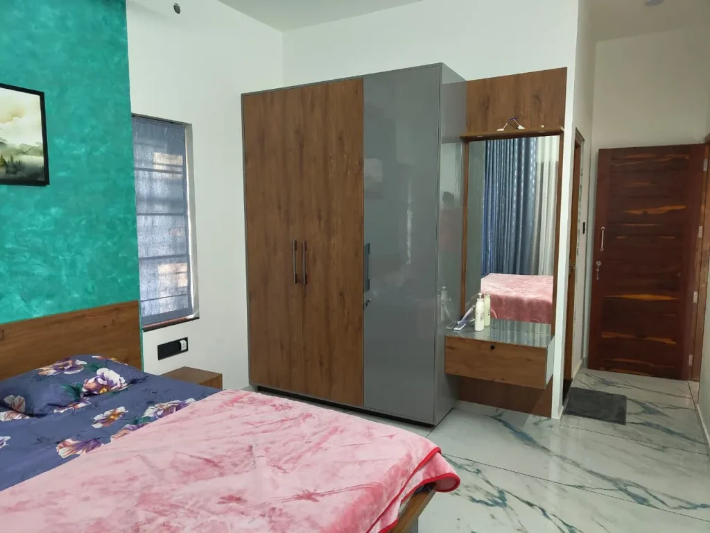 Oak and grey bedroom wardrobe and dresser on marble flooring