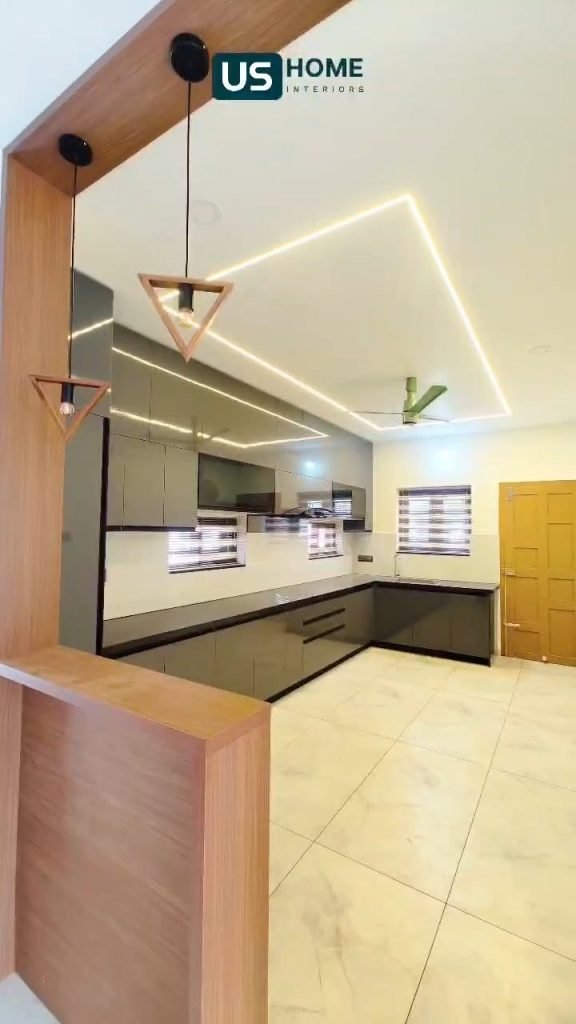 Grey modular kitchen behind a timber partition with linear ceiling lights
