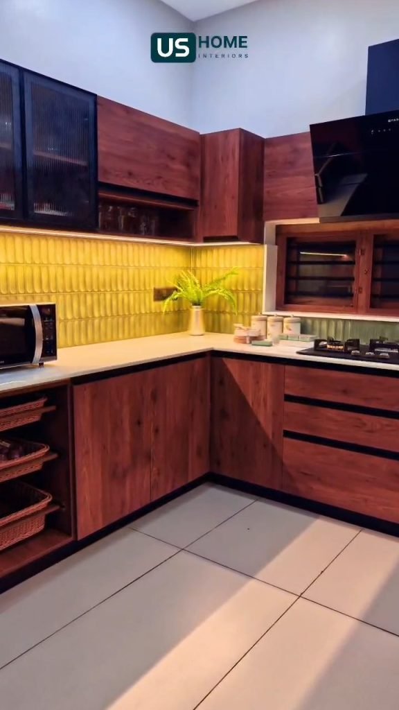 Timber and black modular kitchen with under-cabinet lighting
