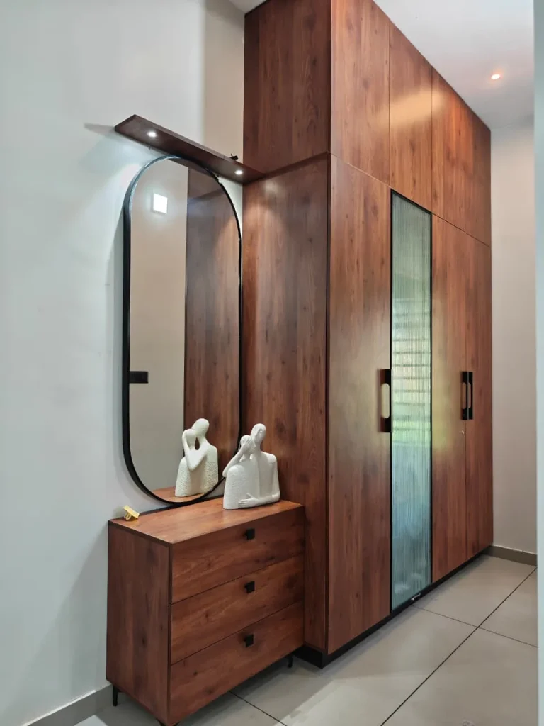 Walnut wardrobe with a fluted-glass door and a capsule mirror above a three-drawer dresser